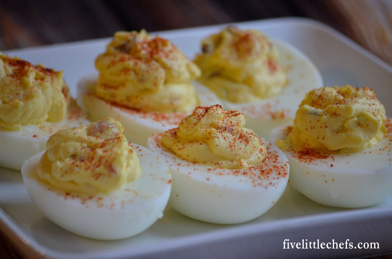 Bacon Deviled Eggs is a twist to the classic. This easy recipe adds in bacon, hot sauce and jack cheese. These will go fast so make sure you make enough for a crowd!