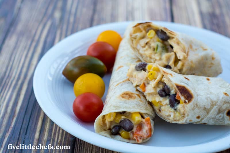 Easy chicken burrito recipe is made with frozen vegetables from the freezer, shredded cheese and rotisserie chicken. This recipe can be completed easily within 30 minutes.