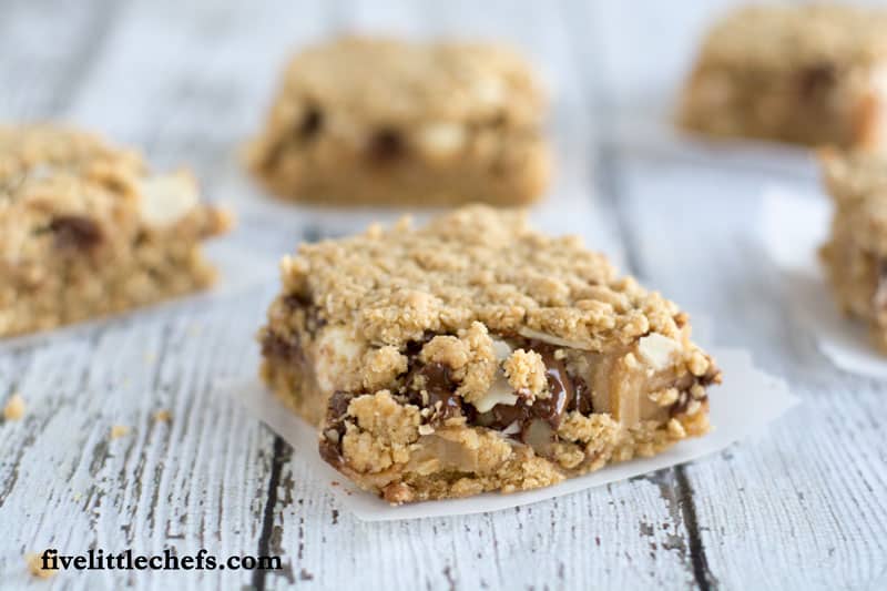 Oatmeal Chocolate Chip Peanut Butter Bars on fivelittlechefs.com is a perfect to serve at a BBQ or fun gathering. This recipe is a tasty treat the will vanish quickly!