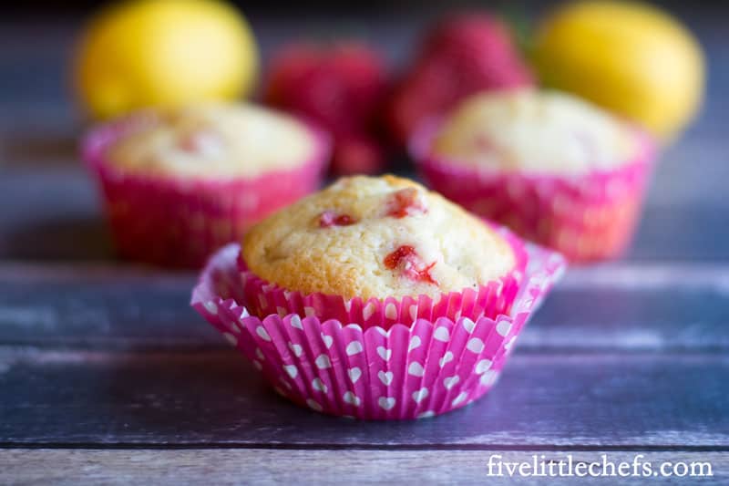 Strawberry Lemonade Muffins are tangy from the lemon juice and sweet from the finely chopped pieces of fresh strawberry. Perfect to make when strawberries are cheap in the spring. These make a delicious breakfast, brunch or snack anytime of the day. fivelittlechefs.com